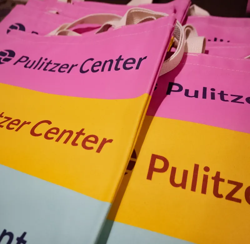 close-up shot of colorful Pulitzer Center bags